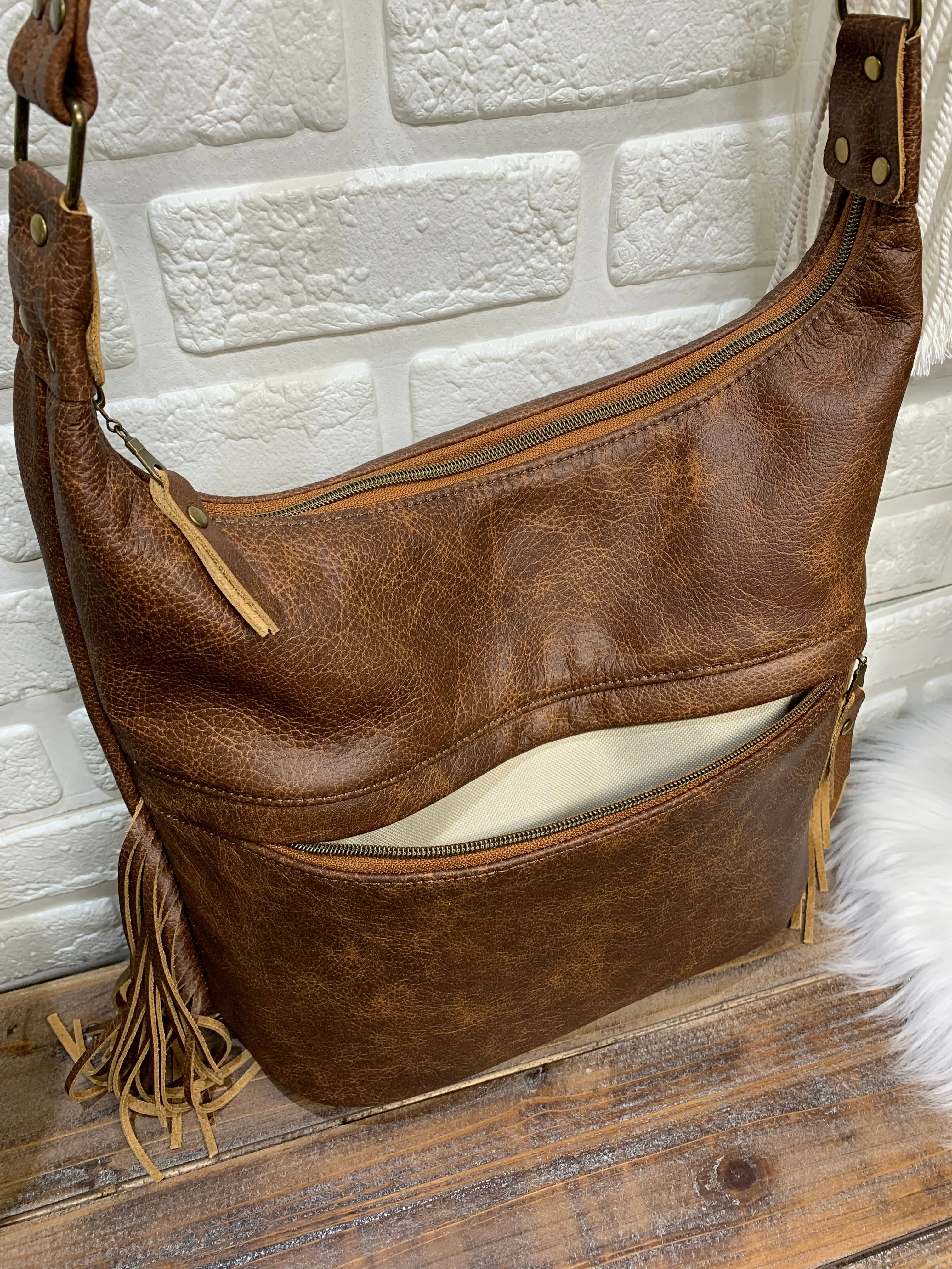 Bucket hobo bag crossbody in saddle brown leather with Fringe