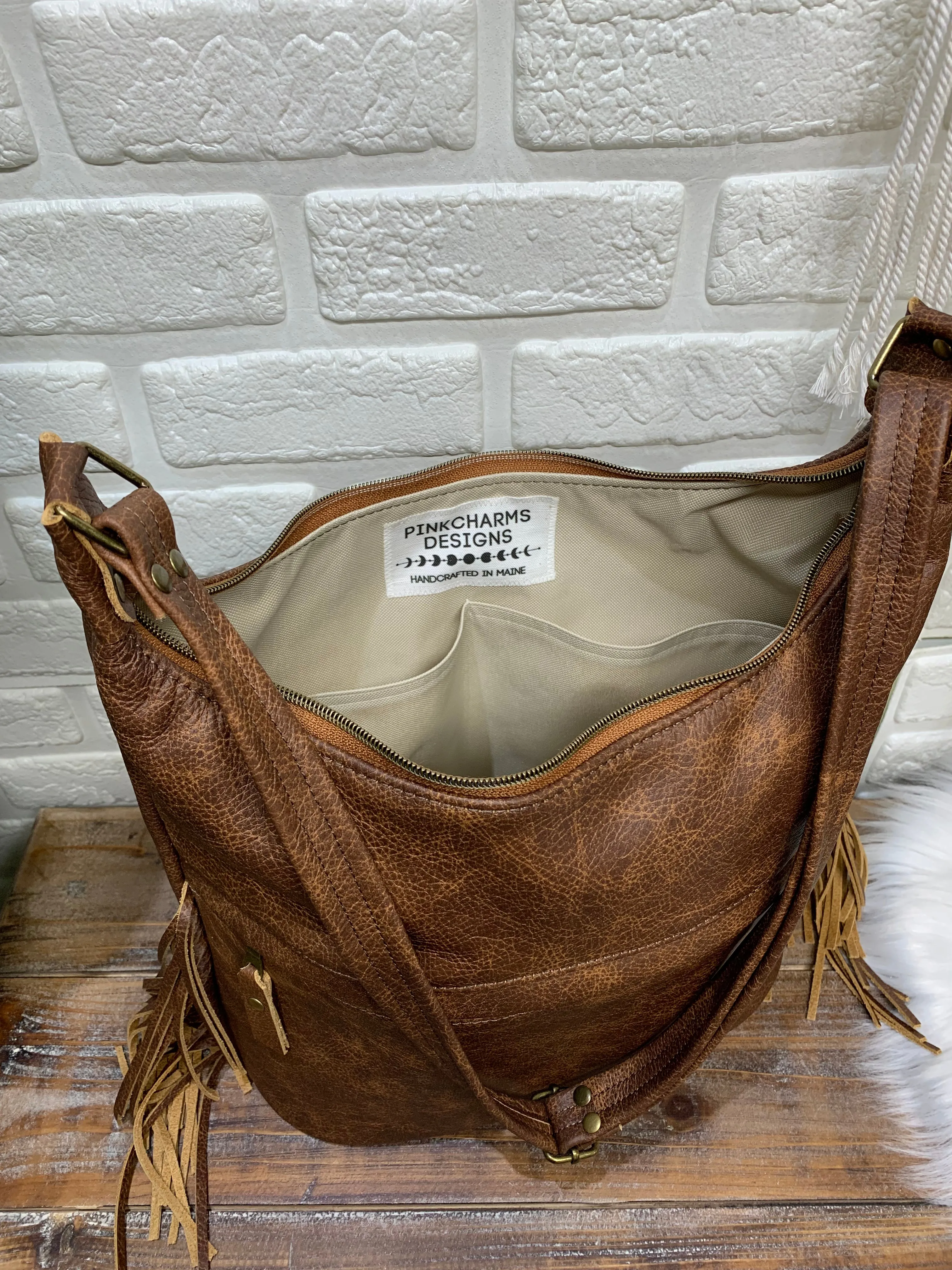 Bucket hobo bag crossbody in saddle brown leather with Fringe